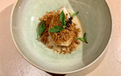 Poached pear on lemongrass coconut cream with crumble