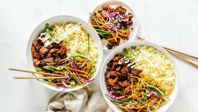 Vegan jackfruit bowl with turmeric rice and Asian slaw